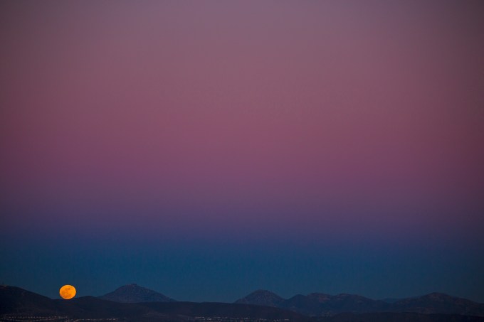Mountain moonrise from Del Mar's Torrey Pines ridge